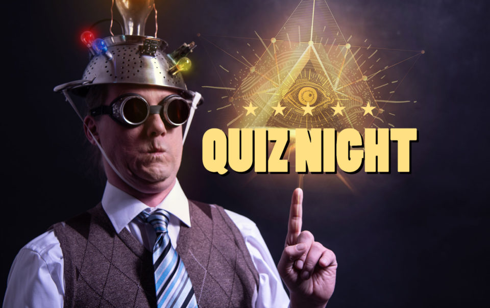 Crazy looking man pointing to a sign that says Quiz Night